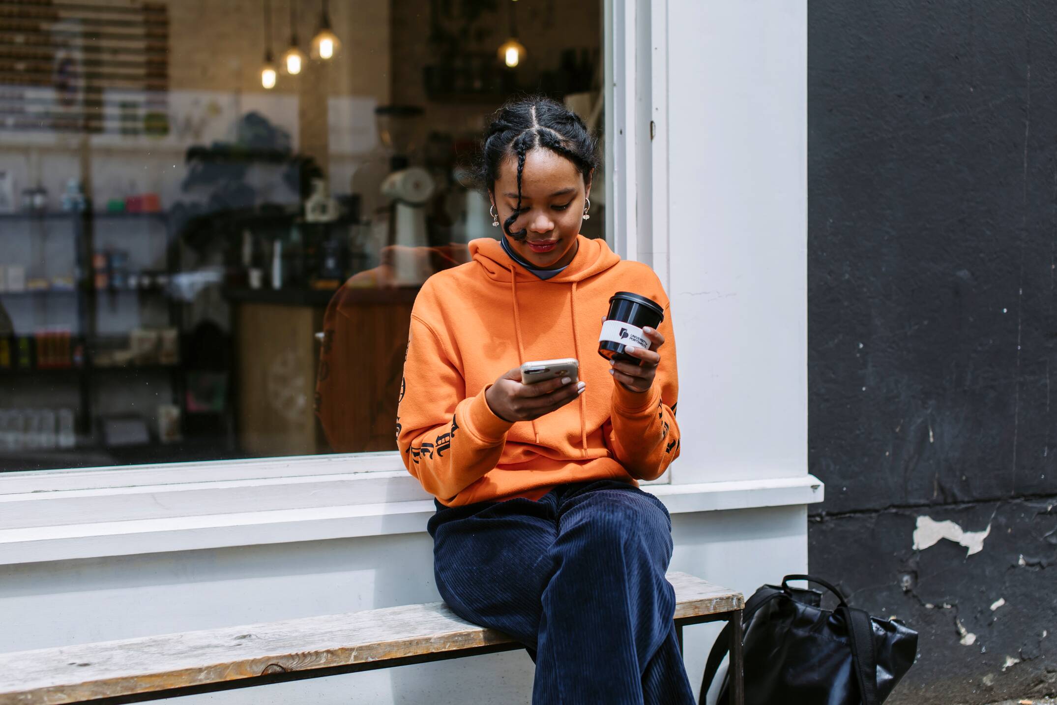 original_compressed-hy_uop_waltham_forest_088.jpg-may_2029.jpg Student on their phone outside