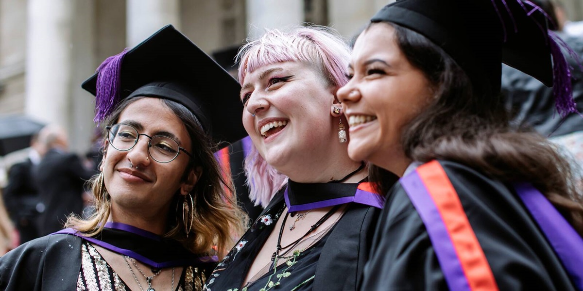 Students celebrating graduation Students celebrating graduation