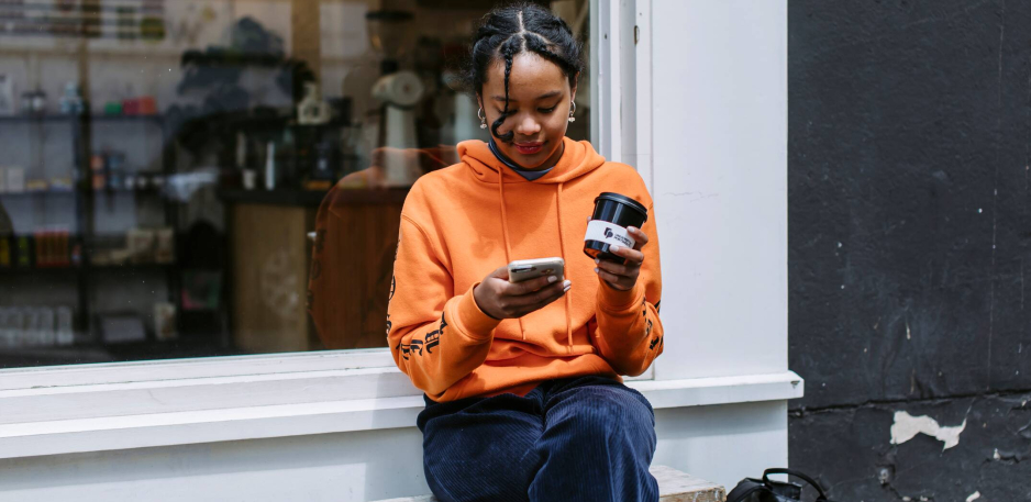 Student on their phone outside